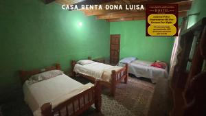 เตียงในห้องที่ Casa Renta Dona Luisa Hostel