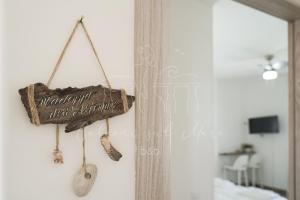 a sign hanging on a wall in a bedroom at Room in BB - BB Balconi Sul Mare deluxe room with hydromassage Madonna Dellaltomare in Otranto