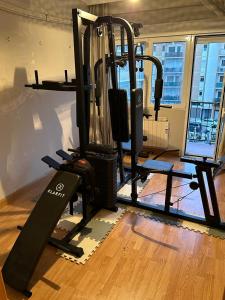 a room with a gym with a treadmill in it at Habitación matrimonial cómoda Av Santa Ana 25 3d in Tudela