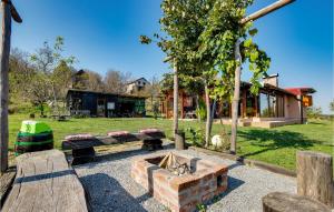 a park with a bench and a fire pit at Amazing Home In Gornji Daruvar With House A Panoramic View in Daruvar