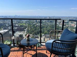 a balcony with chairs and a table and a view at Luxury view in Toronto Downtown 3 Bedroom 2.5 Bathroom 1 Parking in Toronto