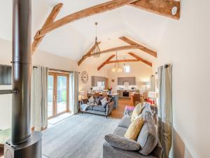 a living room with a fireplace and an open floor plan at Bwlchygwynt in Llanwrda