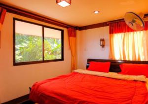 Postel nebo postele na pokoji v ubytování Ban Rabiengfah Resort