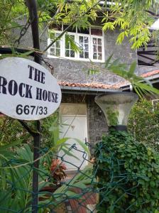 a rock house sign in front of a building at The Rock House in Katunayaka