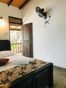 Postel nebo postele na pokoji v ubytování Ganesh Garden Beach Cabanas + 37 fotografií