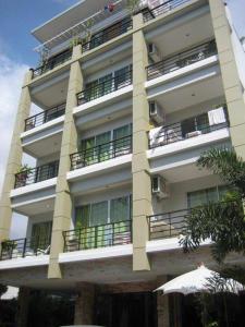 a tall white building with balconies on it at Baan Paan Hua Hin in Hua Hin