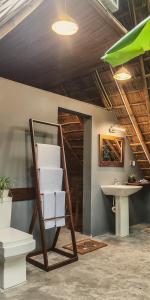 a bathroom with a sink and a shelf and a sink at NJ House in Tangalle