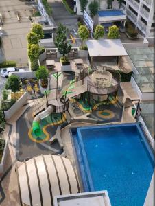 an overhead view of a pool at a resort at Sky Tree Studio Apartment at Bukit Indah, Johor in Johor Bahru