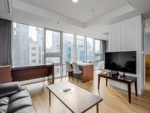 TV a/nebo společenská místnost v ubytování Haeundae Seacloud Hotel Residence