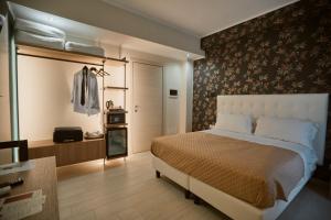 A bed or beds in a room at Castrichella Boutique Hotel Rome Airport