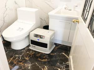 a bathroom with a toilet and a toaster at LIFT IN HAKUBA GORYU - Vacation STAY 71289v in Iida