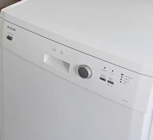 a close up of a white dishwasher at Sky IZMIR Center Big Suit Home in İzmir