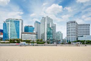 a view of a city with tall buildings at Haeundae Seacloud Hotel Residence in Busan