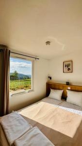 Postel nebo postele na pokoji v ubytování Mariseltinyhouse