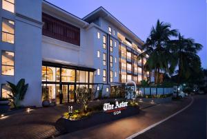 a building with a sign that says the art hotel at The Astor - All Suites Hotel Candolim Goa in Candolim