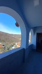 a blue room with a view of a mountain at Luxury,2 level penthouse in Tsakhkadzor in Tsaghkadzor
