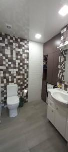 a bathroom with a toilet and a sink at Luxury,2 level penthouse in Tsakhkadzor in Tsaghkadzor