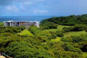 an aerial view of a resort surrounded by trees at L'eau Bleue Boracay Condotel in Boracay