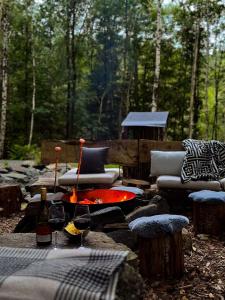 a fire pit in the middle of a forest at The Lodge in Mölnlycke