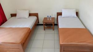 Letto o letti in una camera di Hotel Tentrem Syariah