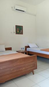 Letto o letti in una camera di Hotel Tentrem Syariah