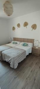 A bed or beds in a room at Apartamento Beretaberri