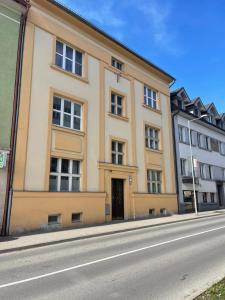 a large building on the side of a street at Elegantný Art Deco byt v Banskej Bystrici in Banská Bystrica