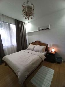 Postel nebo postele na pokoji v ubytování RLJ Beach House