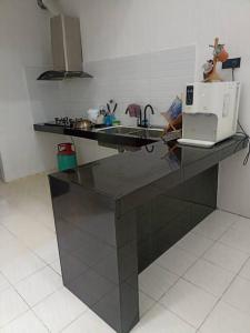 Köök või kööginurk majutusasutuses MinAn Homestay Gua Musang (no tv no wifi)