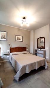 Postel nebo postele na pokoji v ubytování Gli Ulivi Rooms