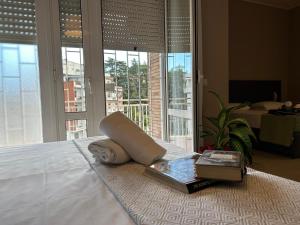 a hotel room with a bed with a book and a book at Villa Angeli in Rome