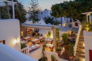 an aerial view of a restaurant with tables and chairs at 23 Hotel Mykonos in Mýkonos City