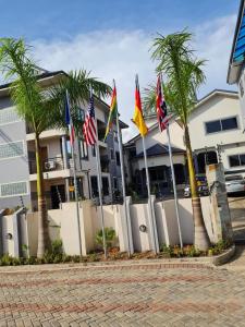 a row of flags in front of a building at Queen's Hill Lodge in Oblogo