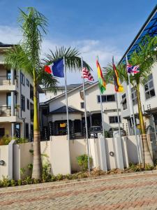 a row of flags in front of a building at Queen's Hill Lodge in Oblogo