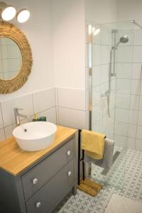 a bathroom with a sink and a shower at Downtown apartment 2 minutes from Opera House in Budapest