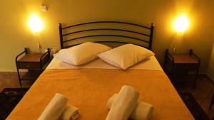 Posteľ alebo postele v izbe v ubytovaní Guesthouse Eleftherios