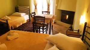 Posteľ alebo postele v izbe v ubytovaní Guesthouse Eleftherios