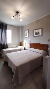 Postel nebo postele na pokoji v ubytování Gli Ulivi Rooms