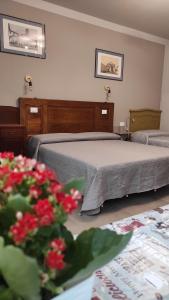 Postel nebo postele na pokoji v ubytování Gli Ulivi Rooms