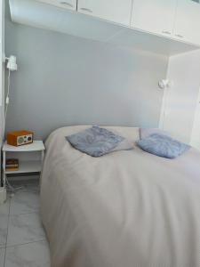 Postel nebo postele na pokoji v ubytování Ylläs Kanerva 105
