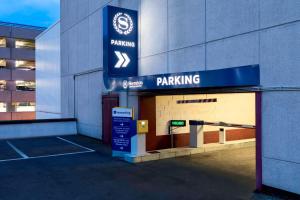 a parking sign on the side of a building at Sheraton Brussels Airport Hotel in Zaventem