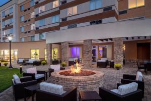 a courtyard with a fire pit in front of a building at Courtyard by Marriott Charleston Downtown/Civic Center in Charleston