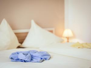 Ein Bett oder Betten in einem Zimmer der Unterkunft Pension Regia