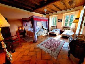 a living room with two beds and a couch at Antica Locanda La Tinara del Belvedere - Romantic Dreams - in Galbiate