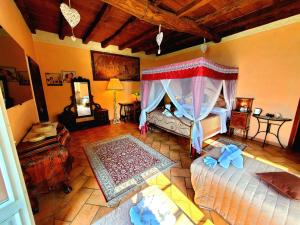 an aerial view of a bedroom with two beds at Antica Locanda La Tinara del Belvedere - Romantic Dreams - in Galbiate
