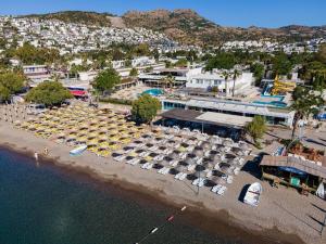 an aerial view of a parking lot with parked boats at Petunya Beach Resort in Ortakent