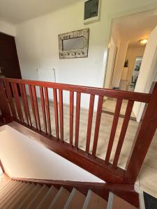 a wooden stairway in a house with a hallway at Apartments Heart in Ljubljana