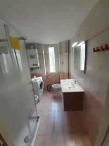 a bathroom with a sink and a toilet at Dom&Fla Università Stazione Tiburtina in Rome