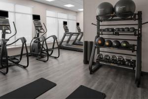 a gym with several treadmills and exercise bikes at TownePlace Suites by Marriott Sacramento Rancho Cordova in Rancho Cordova