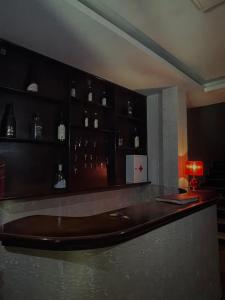 a bar with a brown tub in a room at Hotel sofra in Ferizaj